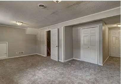 unfurnished bedroom featuring carpet floors and a closet