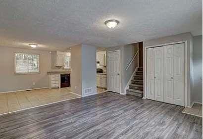 basement with dark hardwood / wood-style floors