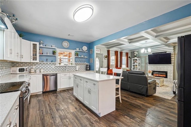 kitchen with open shelves, coffered ceiling, dark wood-type flooring, and appliances with stainless steel finishes