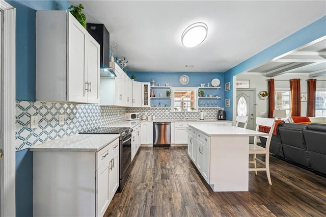 kitchen with electric range, open shelves, open floor plan, a breakfast bar area, and dishwasher