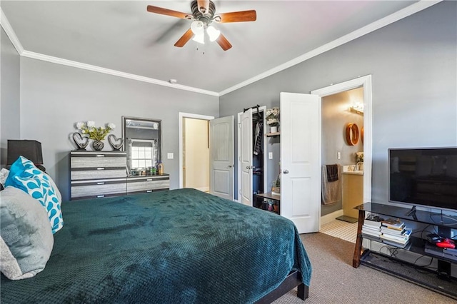 carpeted bedroom with ensuite bath, crown molding, and ceiling fan