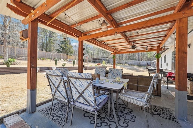 view of patio with outdoor dining area and a fenced backyard