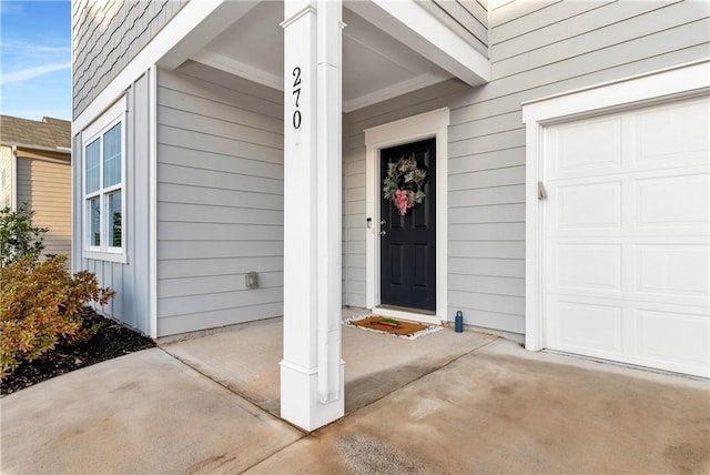 doorway to property featuring a garage