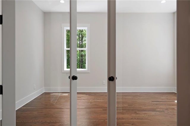 interior space with recessed lighting, baseboards, and dark wood finished floors