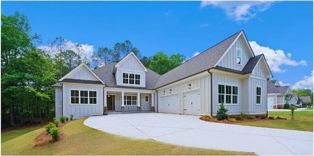 view of front facade with a garage and a front lawn