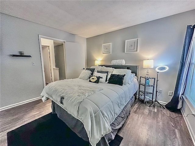 bedroom with hardwood / wood-style floors