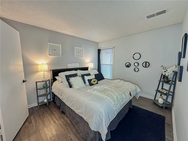 4359 Idlewood Ln, Tucker, GA 30084 - bedroom featuring baseboards, dark wood-style flooring, and visible vents