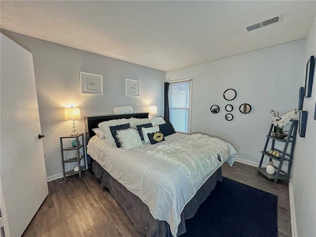 bedroom featuring dark wood-type flooring