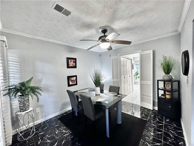 dining area featuring crown molding, a textured ceiling, and ceiling fan