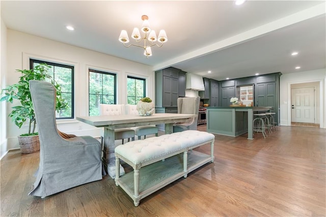 dining room with a chandelier and hardwood / wood-style floors