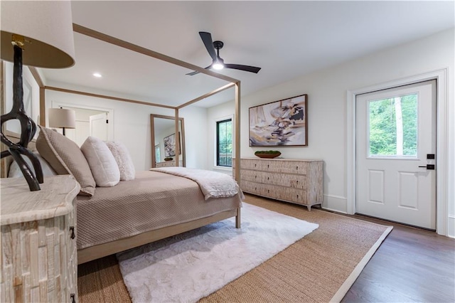 bedroom with dark wood-type flooring and ceiling fan