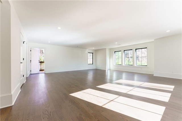 empty room featuring dark hardwood / wood-style flooring