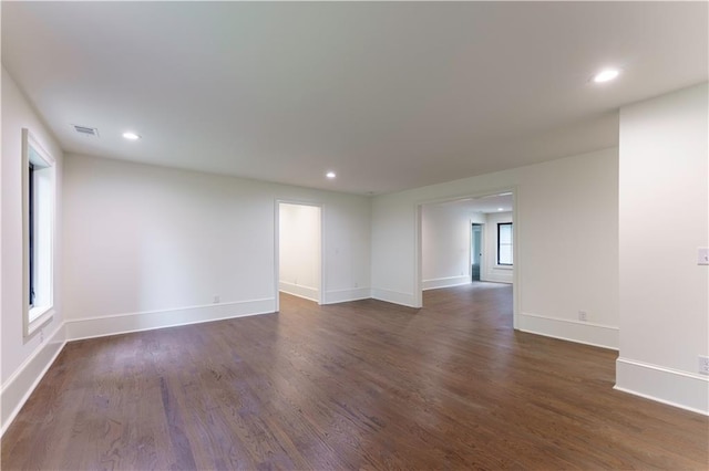 empty room featuring dark hardwood / wood-style floors