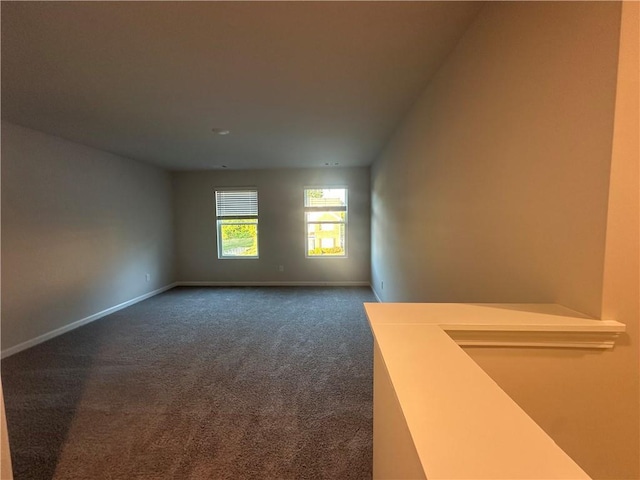 11045 Shadow Creek Ter, Hampton, GA 30228 - spare room with dark colored carpet and baseboards