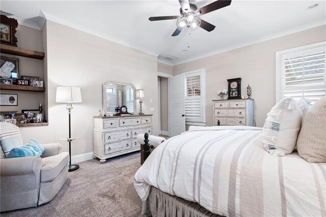 bedroom featuring crown molding, a ceiling fan, baseboards, and carpet floors