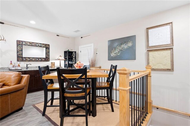 dining room featuring recessed lighting and light wood-style floors