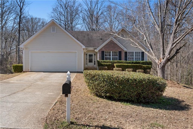 ranch-style house with driveway, a garage, and brick siding