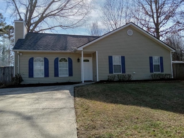 ranch-style house with a front lawn