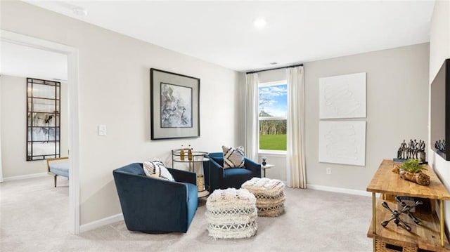 sitting room with light carpet