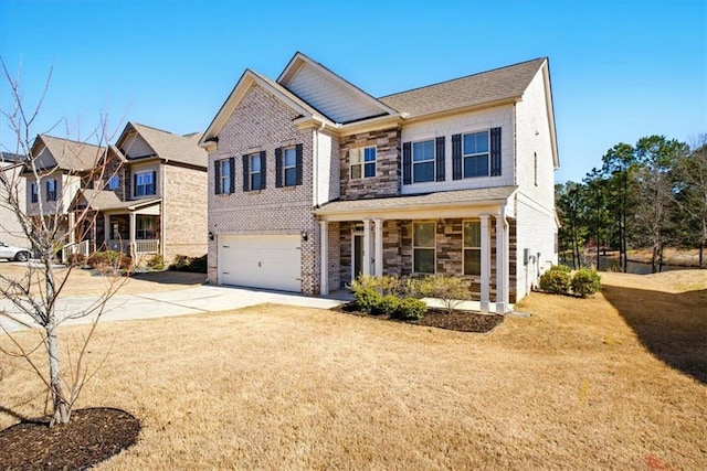 view of front of house featuring driveway, a front lawn, a garage, stone siding, and brick siding