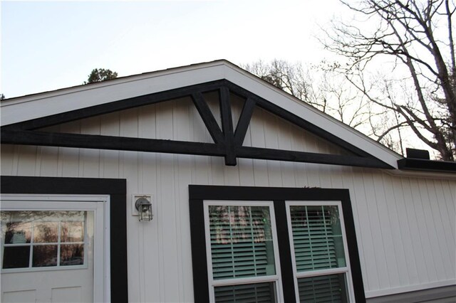 room details featuring a ceiling fan and beam ceiling