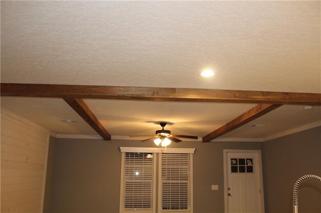 interior details featuring ceiling fan and beam ceiling