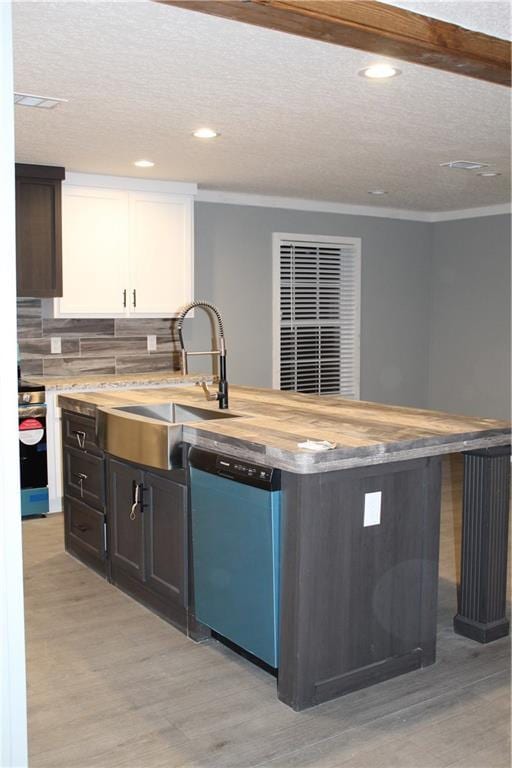 kitchen with white cabinetry, dishwasher, sink, and light wood-type flooring