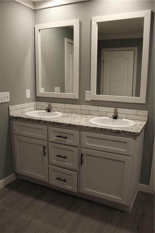 bathroom featuring vanity and hardwood / wood-style floors