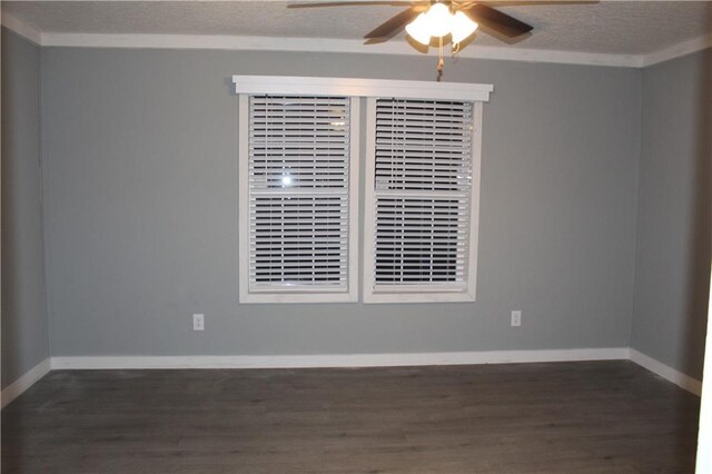 empty room featuring ceiling fan, dark hardwood / wood-style floors, and a textured ceiling