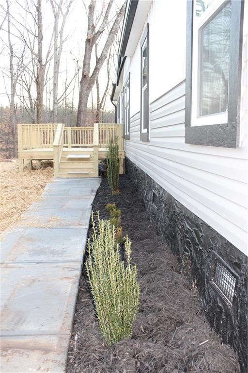 view of side of property featuring crawl space