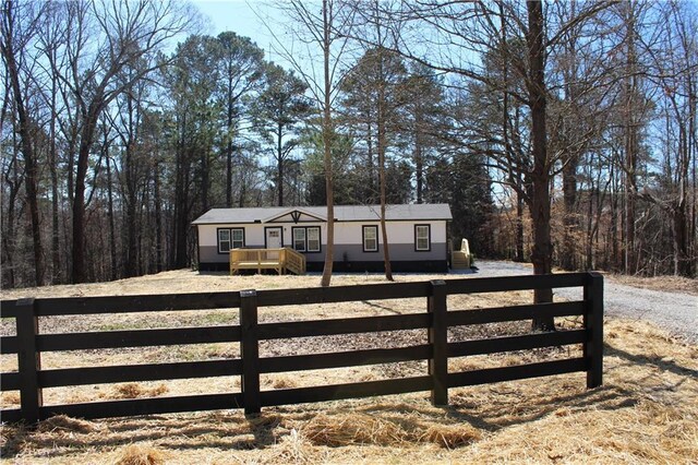 view of front of home featuring crawl space and a wooden deck