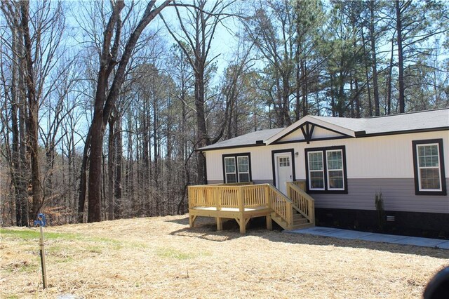 view of side of home featuring crawl space