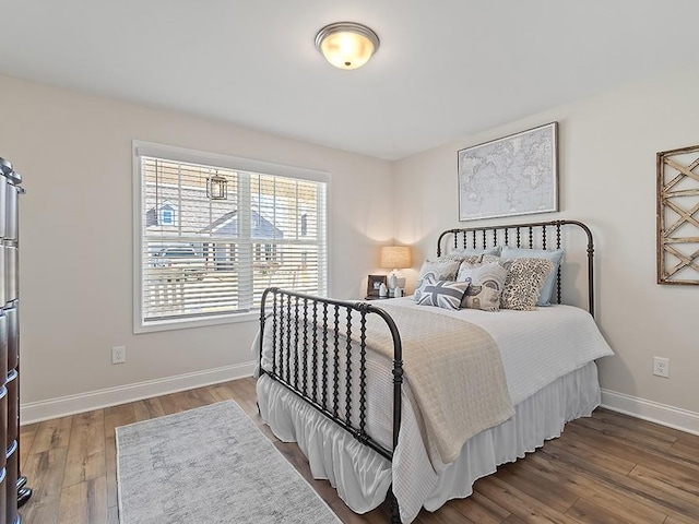 bedroom with hardwood / wood-style floors