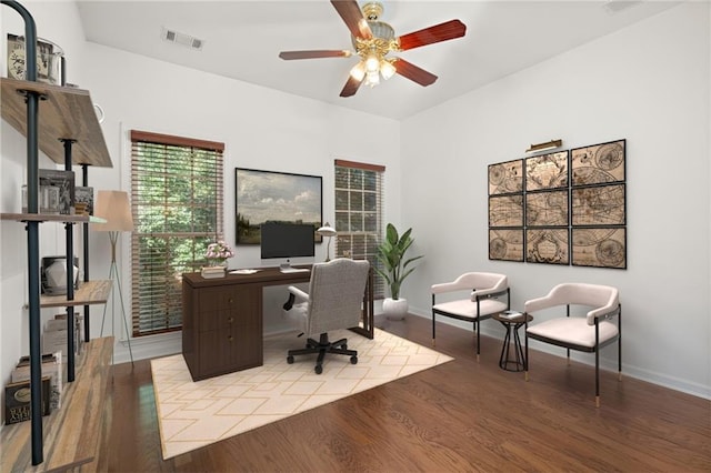 office space featuring ceiling fan and light wood-type flooring