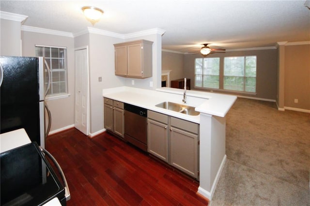 kitchen with light countertops, freestanding refrigerator, open floor plan, dishwasher, and a peninsula