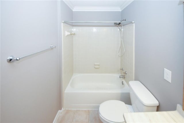 full bathroom featuring toilet, tile patterned flooring, crown molding, and bathing tub / shower combination