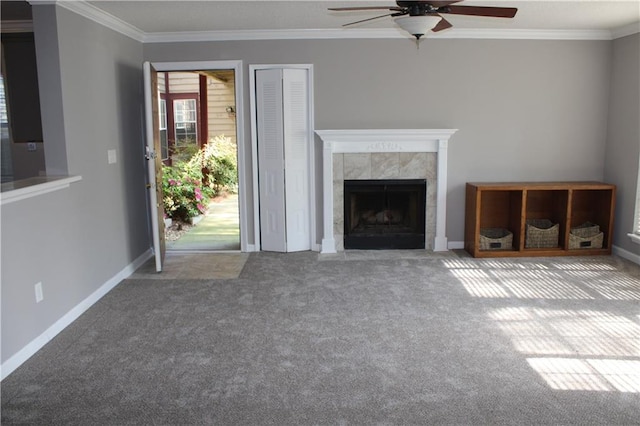 unfurnished living room with carpet, a fireplace, and crown molding