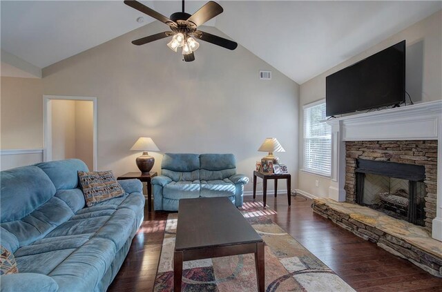 dining room featuring dark wood-type flooring, vaulted ceiling, and ceiling fan with notable chandelier