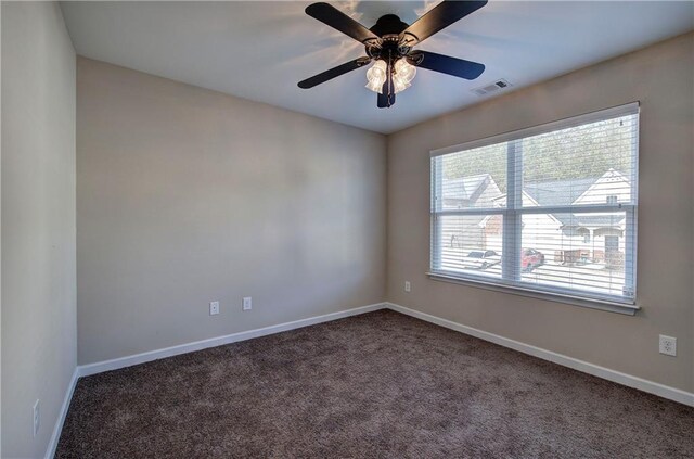 unfurnished bedroom featuring a closet and dark colored carpet