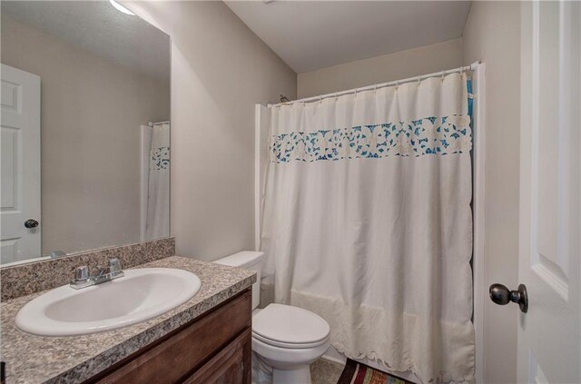 unfurnished bedroom with ceiling fan and dark colored carpet