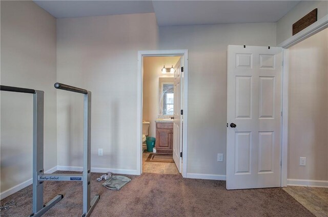 workout area featuring carpet flooring