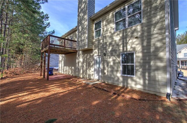 view of side of home featuring central AC