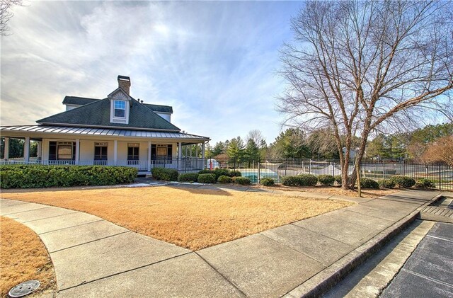 view of front of property with a garage and central air condition unit