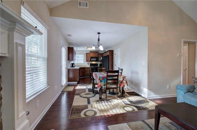 living room featuring ceiling fan with notable chandelier, high vaulted ceiling, and dark hardwood / wood-style floors