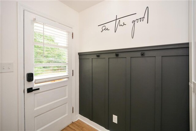 mudroom with light hardwood / wood-style floors