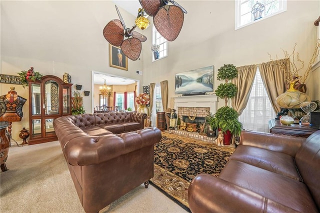 carpeted living area with a notable chandelier, a brick fireplace, and visible vents