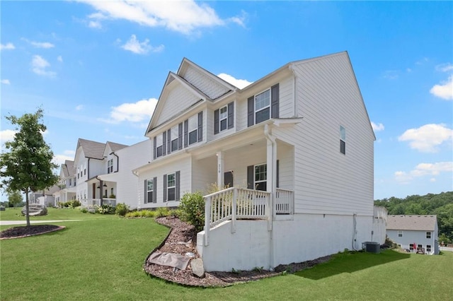 exterior space featuring covered porch and a front lawn