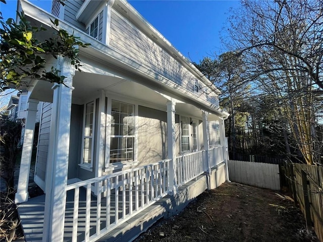 view of side of home featuring a porch