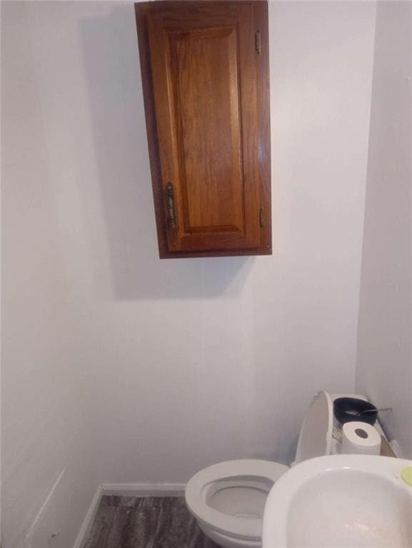 1105 Oak Knoll Ter, Atlanta, GA 30315 - half bathroom with a sink, baseboards, and toilet