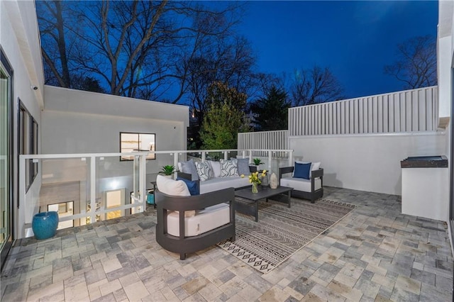 patio at night with outdoor lounge area